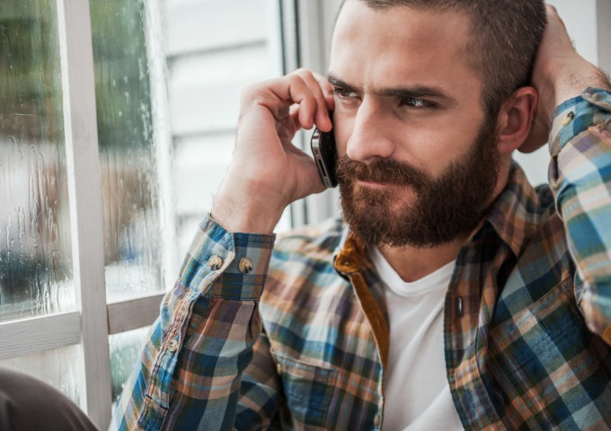Man on phone getting help for Post-Traumatic Stress Disorder (PTSD)