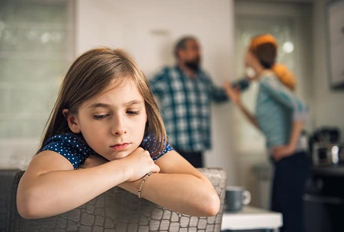 Child listening to parents arguing