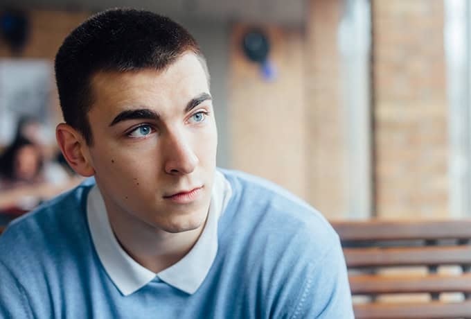 Man waiting for a drink at a bar