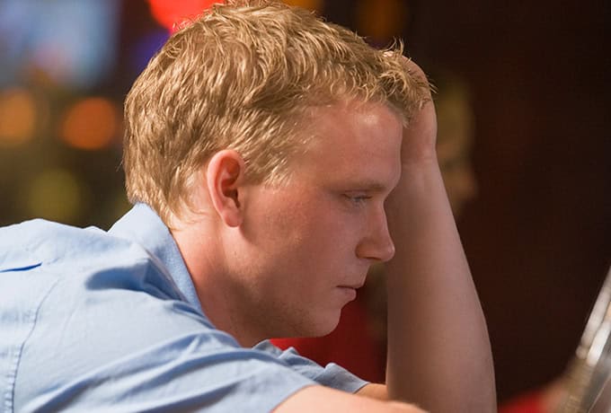 Man at pokies with gambling addiction
