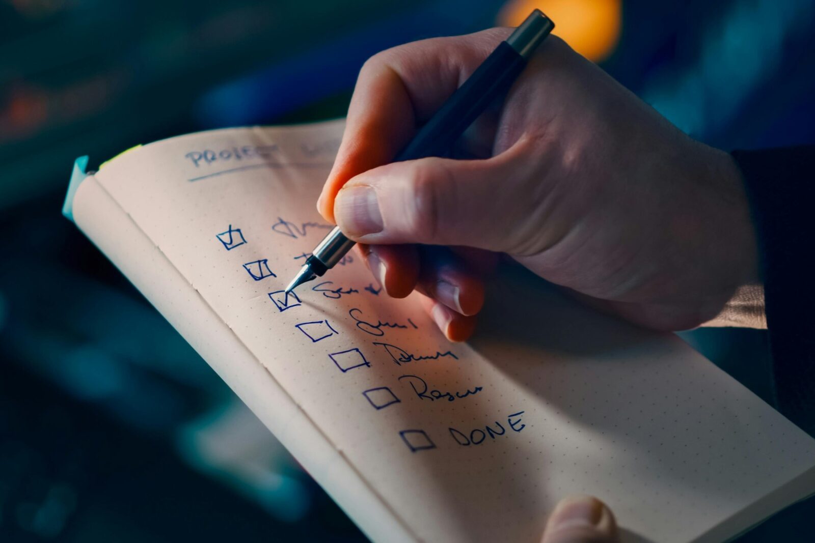 Hand Writing on Notebook with Checklist